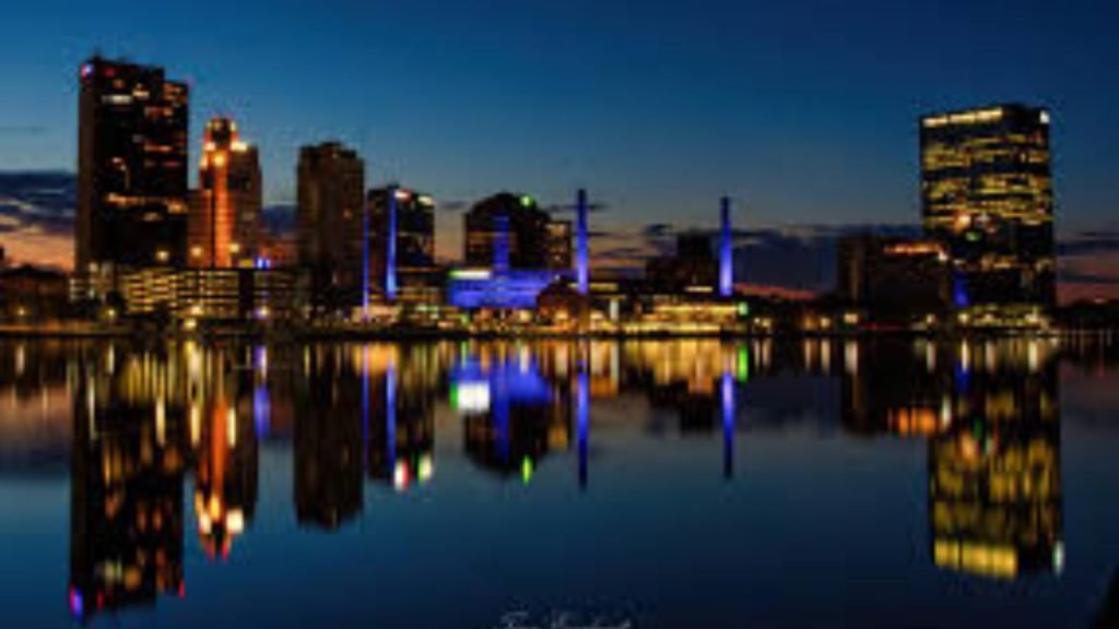 Toledo skyline in Lucas County Ohio with downtown buildings reflecting over the Maumee River